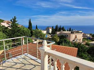 a view from the balcony of a house at Viola Rooms in Dhërmi