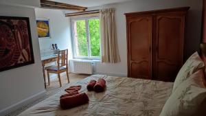 Postel nebo postele na pokoji v ubytování Le moulin Grenon