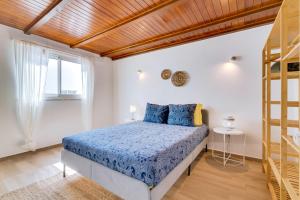 Postel nebo postele na pokoji v ubytování Casa Ramiro II Escapadinha na Ilha da Culatra