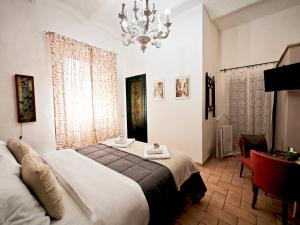 Postel nebo postele na pokoji v ubytování La Casa dei Carrai