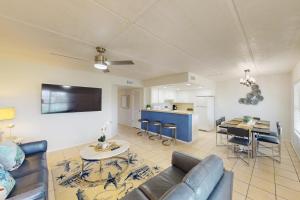 a living room with a couch and a table at Fiesta Sol Condominiums in South Padre Island