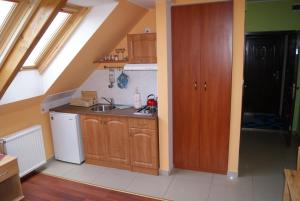 a kitchen with a sink and a counter top at Domowe Zacisze in Ustka