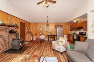 a living room with a fireplace and a stove at Private w Screened Porch, Deck & Dog-Friendly! in Luray +43 photos