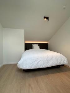Tempat tidur dalam kamar di Manteka Logies