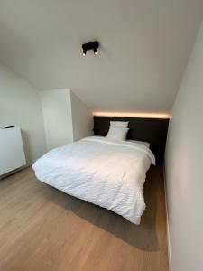 Tempat tidur dalam kamar di Manteka Logies