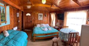 Posezení v ubytování Cabañas y Hostal Isla Mágica