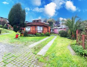 Zahrada ubytování Cabañas y Hostal Isla Mágica