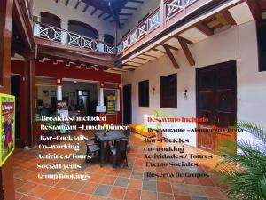 a room with words on the side of a building at Casona Don Juan Hostel in San Gil