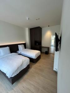Tempat tidur dalam kamar di Manteka Logies