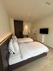 Tempat tidur dalam kamar di Manteka Logies