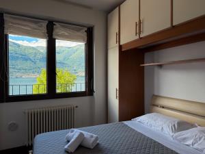 Ένα ή περισσότερα κρεβάτια σε δωμάτιο στο casa Venere - lake view terrace