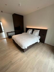 Tempat tidur dalam kamar di Manteka Logies