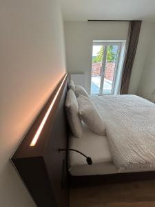 Tempat tidur dalam kamar di Manteka Logies