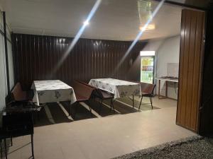 two tables in a room with lights on the ceiling at Дача in Zatoka