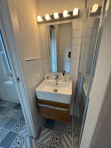 a bathroom with a sink and a mirror at Sidera Cinque Terre Apartments in Biassa +26 photos