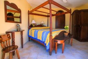 Un pat sau paturi într-o cameră la Casa de La Paz - Beautiful Beachfront Villa +18 fotografii