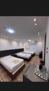 Elite Pyramids View Inn客房内的一张或多张床位