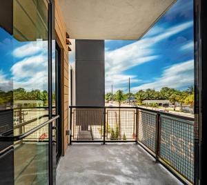 a balcony with a view of a street at Modern 2BR Apt Near Hard Rock with Parking & Gym in Fort Lauderdale