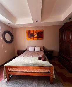 Giường trong phòng chung tại Casa Bismillah Antigua Guatemala