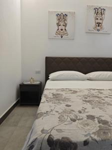 Ένα ή περισσότερα κρεβάτια σε δωμάτιο στο Case Victoria - Mamalu