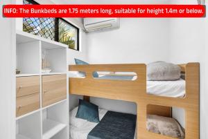 a poster of a bunk bed in a room at Mooloolaba Beach Club Paradise 2 Bedroom Apartment in Mooloolaba +25 photos