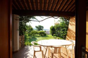 A balcony or terrace at Porto Coda Cavallo Salina Bamba
