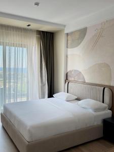 Katil atau katil-katil dalam bilik di Monun Hotel