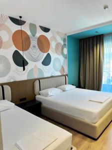 Katil atau katil-katil dalam bilik di Monun Hotel