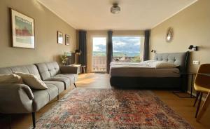 Posezení v ubytování #1 Studioapartment mit Loreleyblick direkt an der schönsten Etappe des Rheinsteigs