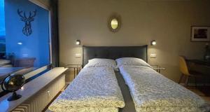 Postel nebo postele na pokoji v ubytování #1 Studioapartment mit Loreleyblick direkt an der schönsten Etappe des Rheinsteigs