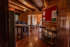 a room with tables and chairs in a log cabin at Lyford Luxury Escape - ML21963 in Mt Lyford +16 photos