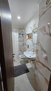 a bathroom with two toilets and a sink at Elegant villa with sea view Agadir in Agadir