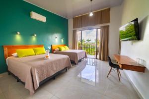 Rúm í herbergi á Hotel Secreto La Fortuna