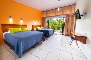 Rúm í herbergi á Hotel Secreto La Fortuna