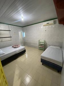 Ένα ή περισσότερα κρεβάτια σε δωμάτιο στο Casa Tupiara Murubira - Your place in COP 30 +33 φωτογραφίες