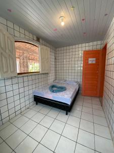 Ένα ή περισσότερα κρεβάτια σε δωμάτιο στο Casa Tupiara Murubira - Your place in COP 30