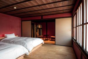 Ένα ή περισσότερα κρεβάτια σε δωμάτιο στο 阡陌senpakuせんぱく