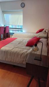 Ένα ή περισσότερα κρεβάτια σε δωμάτιο στο Loft Esmeralda