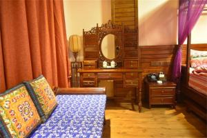 Posteľ alebo postele v izbe v ubytovaní Zhangjiajie Wulingju Hotel