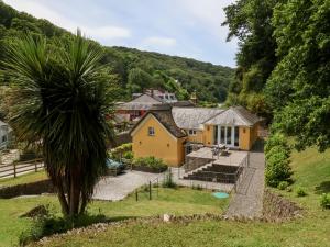 an aerial view of a house with a palm tree at Old Maids Cottage in Ilfracombe
