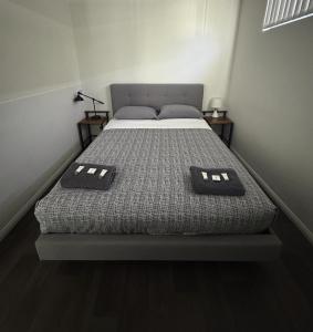 a bed in a room with two pillows on it at Manjimup Gateway Hotel in Manjimup