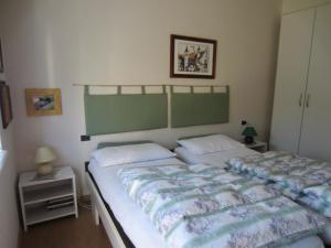 A bed or beds in a room at Condominio Zorzi