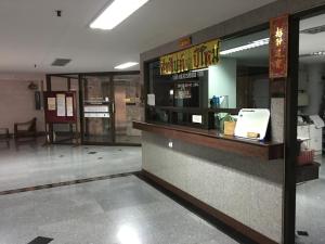 a fast food restaurant with a sign on the counter at S.K. Residence in Bangkok