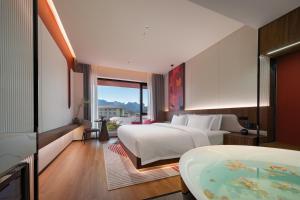 Zhangjiajie Yujie Hotel客房内的一张或多张床位