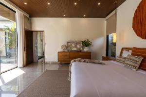 Postel nebo postele na pokoji v ubytování Nococu Luxury Villa