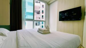 Ένα ή περισσότερα κρεβάτια σε δωμάτιο στο City Garden Olympus by dw +23 φωτογραφίες