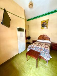 Postel nebo postele na pokoji v ubytování Hotel Principal