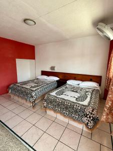 Postel nebo postele na pokoji v ubytování Hotel Principal