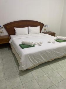 Postel nebo postele na pokoji v ubytování Cousin Resort