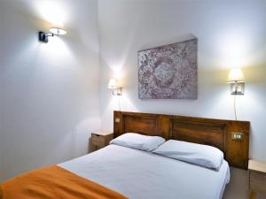 Ένα ή περισσότερα κρεβάτια σε δωμάτιο στο Cosy apartment in Mantignana with private terrace